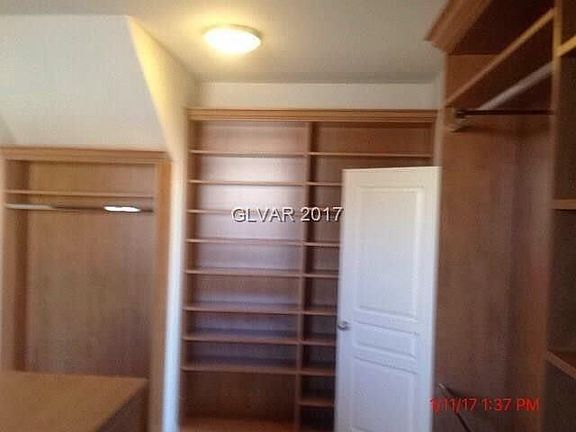 Master closet has a great shelving system