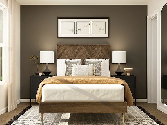 Relaxation is easy in the warm master bedroom.