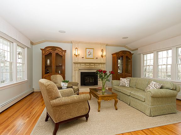Elegant formal living room with walls of windows