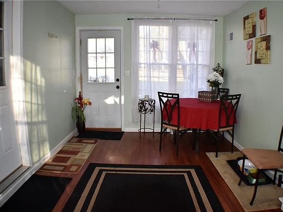 This heated breezeway has so many uses. Dining, mudroom, play room.  Very functional and welcoming.