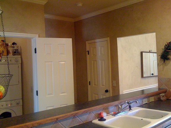 view of laundry and pantry over kitchen bar
