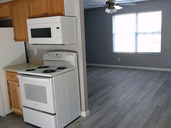 KITCHEN HAS STOVE, REFRIGERATOR AND DISHWASHER.
