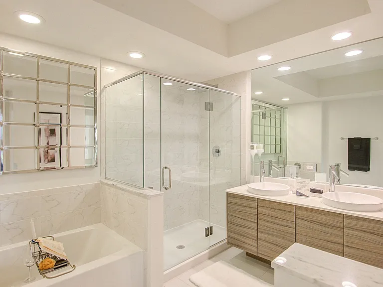 Spacious soaking tub and frameless glass-enclosed shower in select master bathrooms.