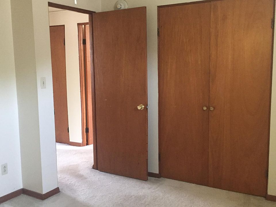 Bedroom with wall-to-wall closets
