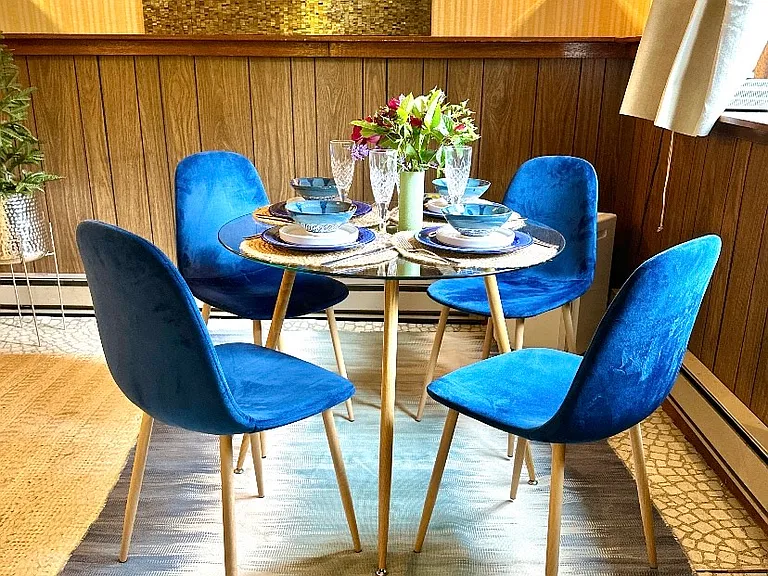 Dining with a view of the garden. A water fountain feature is located just outside of the window.