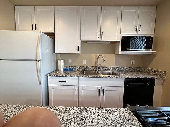 Completely updated kitchen with new cabinets, new appliances and new granite counter tops.