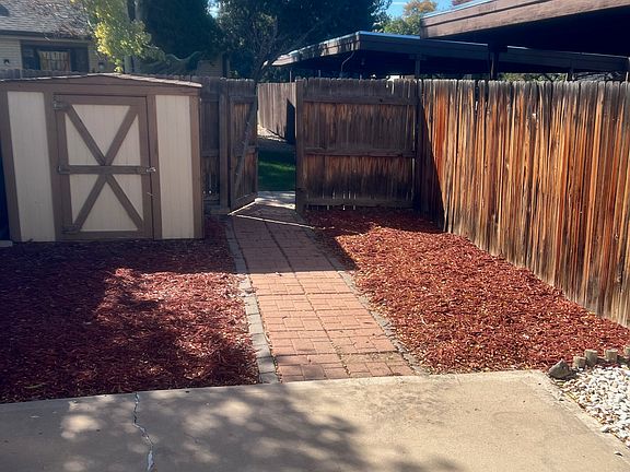 Back yard with extra storage unit.