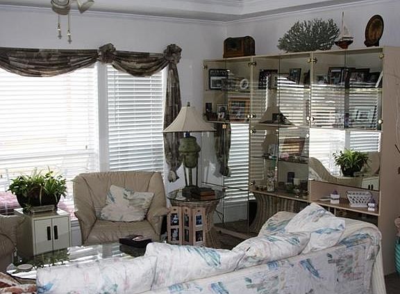 Living room with view to front porch and outside. Room for larg