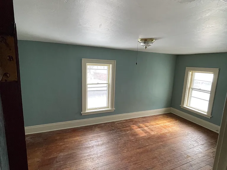 Original hardwood floors throughout entire upstairs, 3 bedrooms. Freshly painted.