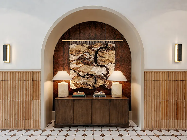 Designer apartment clubhouse with custom artwork, artisan textures, and elevated architectural details.