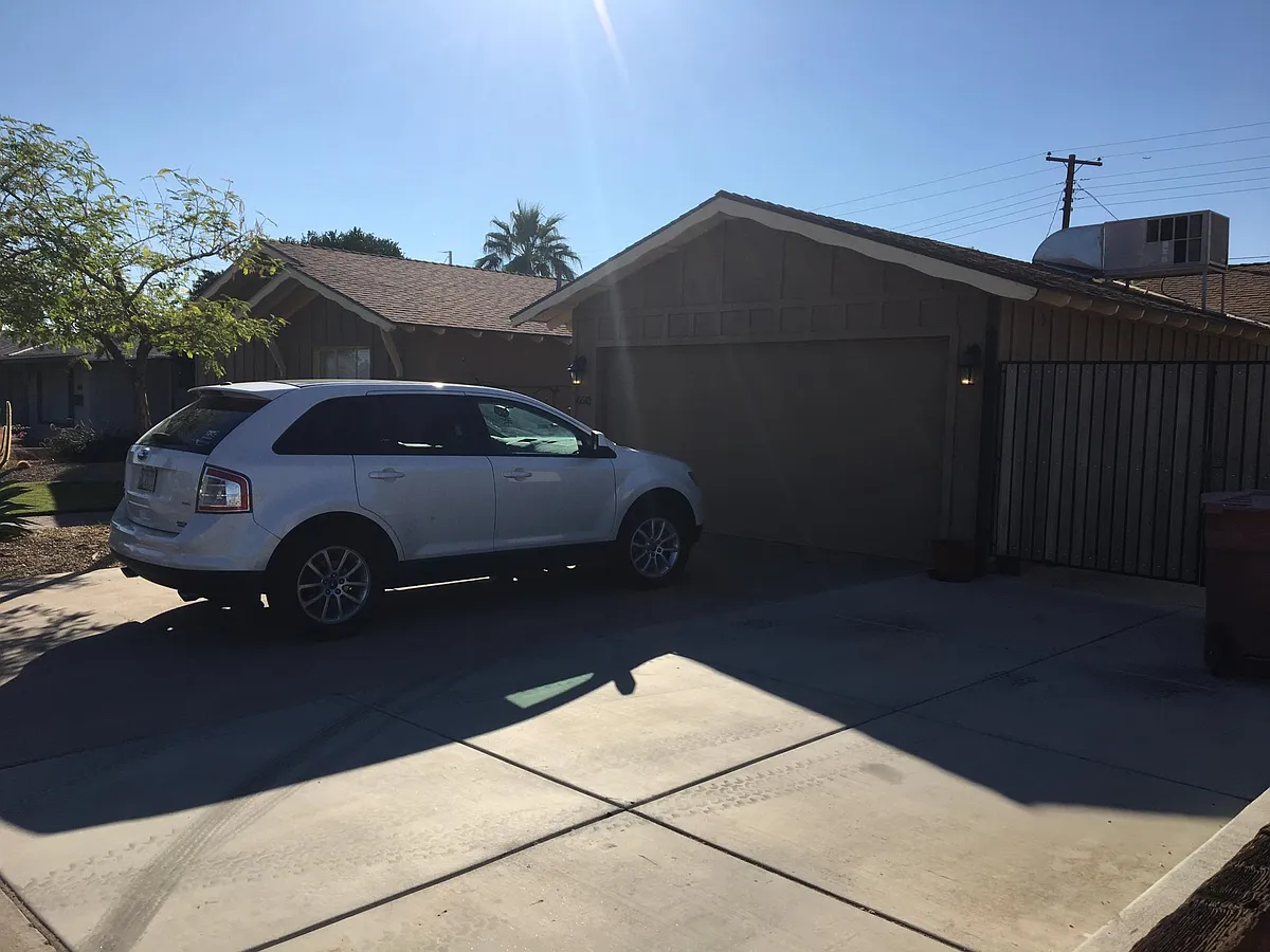 Attached garage and additional concrete slab for parking - 6513 E Vernon Ave