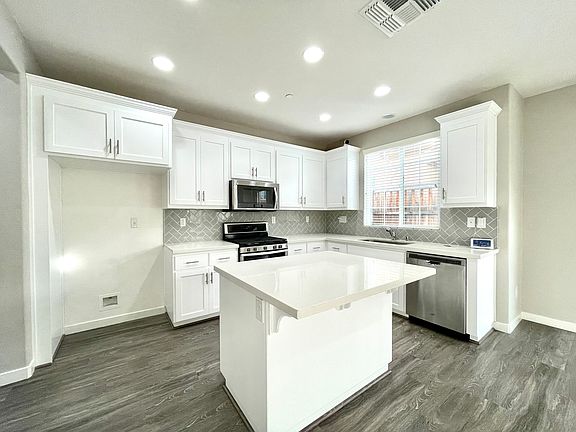 Beautiful Bright Kitchen! Stainless Steel Refrigerator provided at no cost!