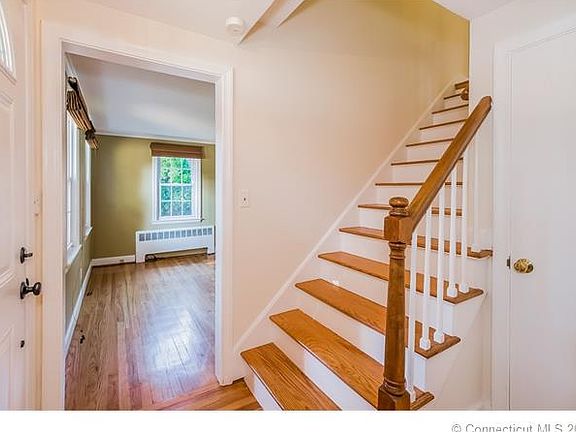 Entry foyer with wood floor...