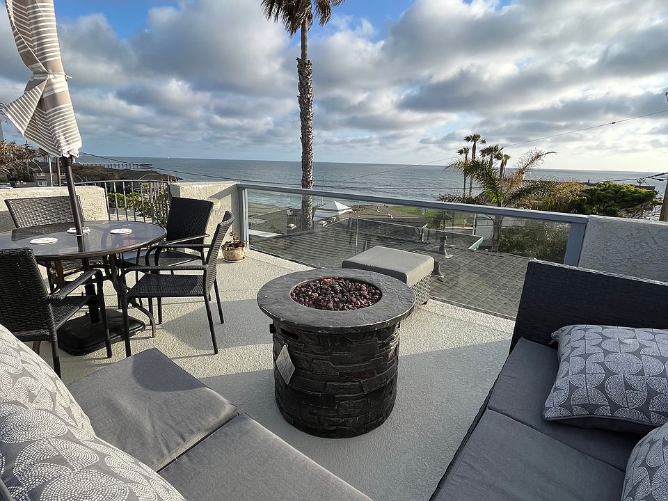 Roof deck with 180 degree ocean views and a firepit!