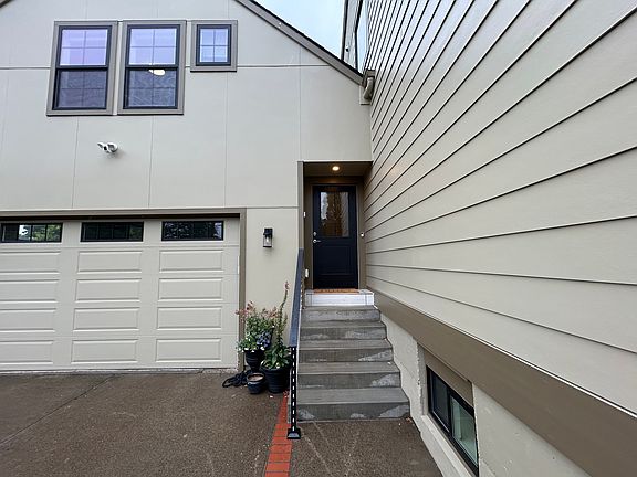 Side entrance leads to apartment