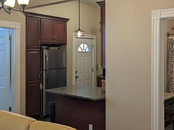 View of rear BR, Kitchen, bath, from LR.