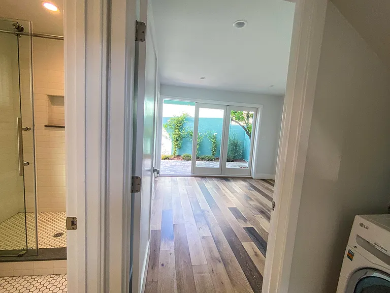 Master bedroom adjacent to bathroom and laundry. French doors lead to private patio.