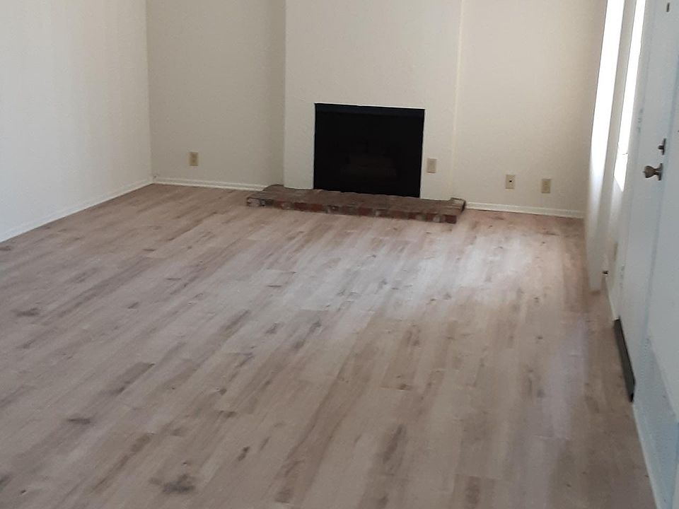 Living Room with fire place and open beam ceiling