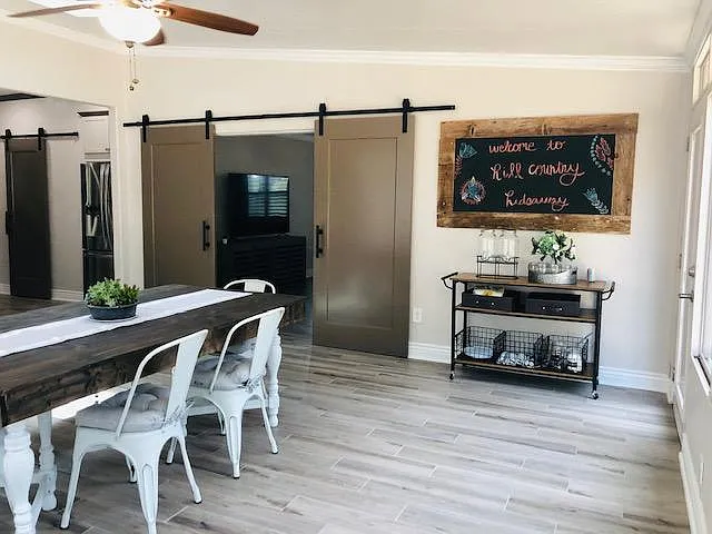 Another view of the dining room with door that leads to the back patio.