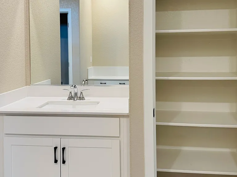 Master bath attached to the master suite with his and hers sinks and additional storage