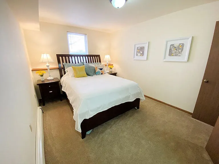 Bedroom with Window and Overhead Light