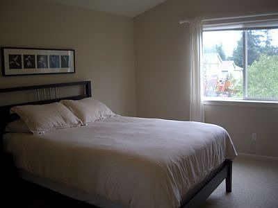 master suite with vaulted ceilings