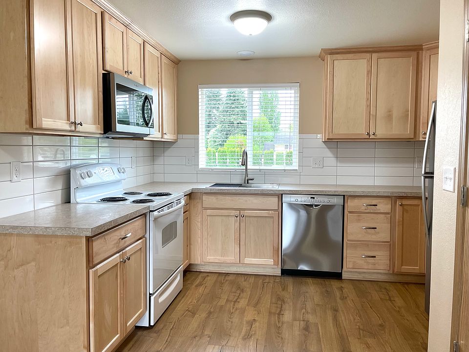 This sleek kitchen is the heart of the home!