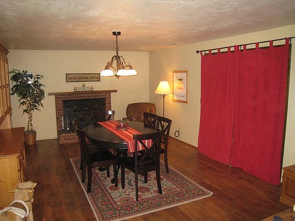 Formal Dining/Family room with fireplace and wood flooring!.