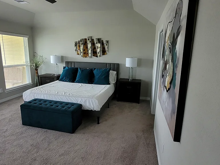 Large primary bedroom with king size bed