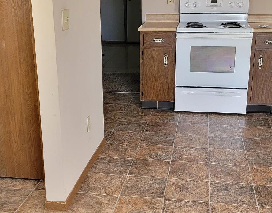 Kitchen with Dishwasher, stove and refrigerator.