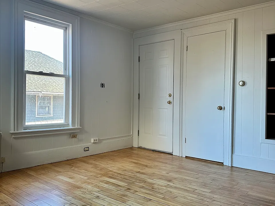 Living room looking towards front door and closet