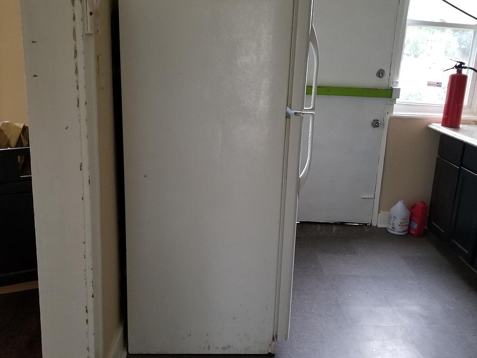 Kitchen with a big refrigerator.