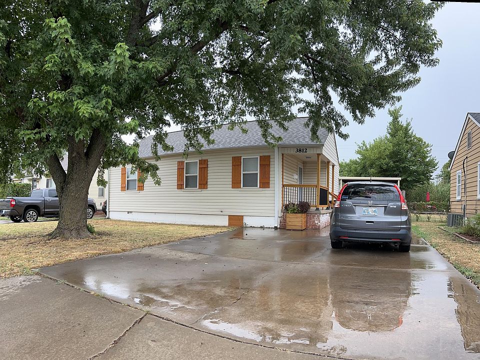 Large drive way with gated single carport