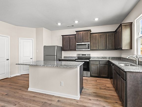 The kitchen has a wonderful island that provides more counterspace.