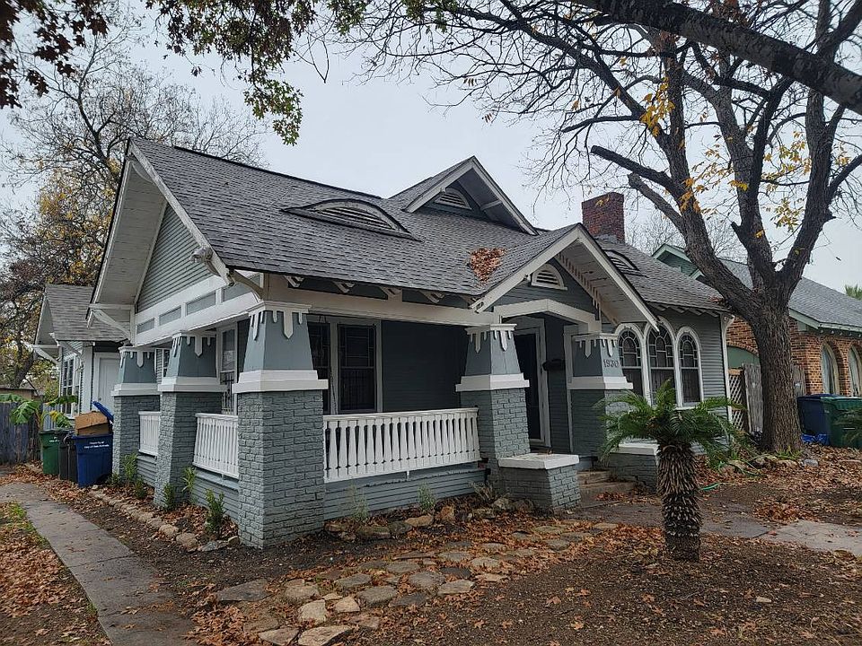Large front porch wraps around the side for a bit of added charm.