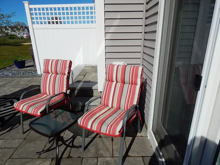 private patio accessed from living room or dining room, comfortable cushioned chairs