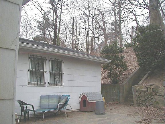 rear of home with rear entance to smaller patio & acessto back yard area