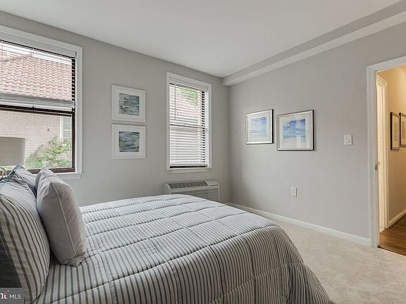 large windows and much light - NOTE - Hardwood floors replacing carpeting!