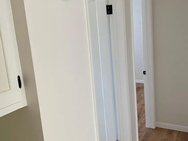 Hallway, facing north. Bathroom in middle.
