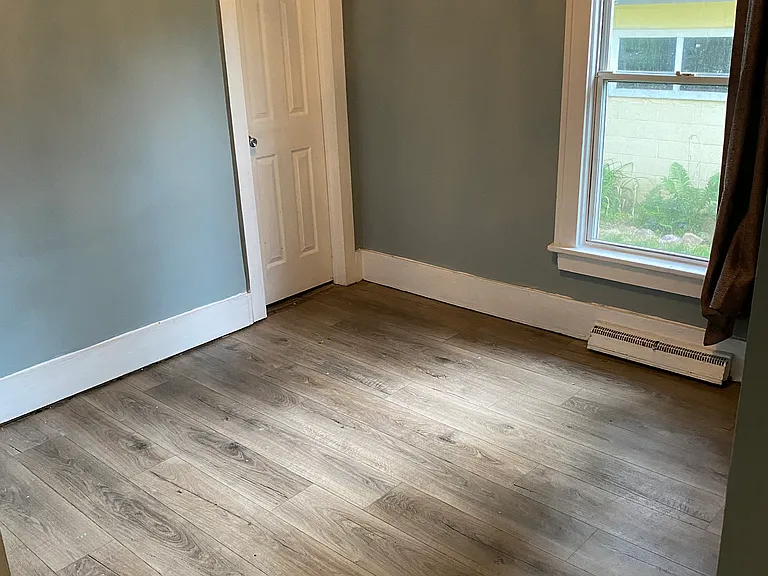 Master bedroom with 8 ' closet and staircase leading to 12' x 30' attic.