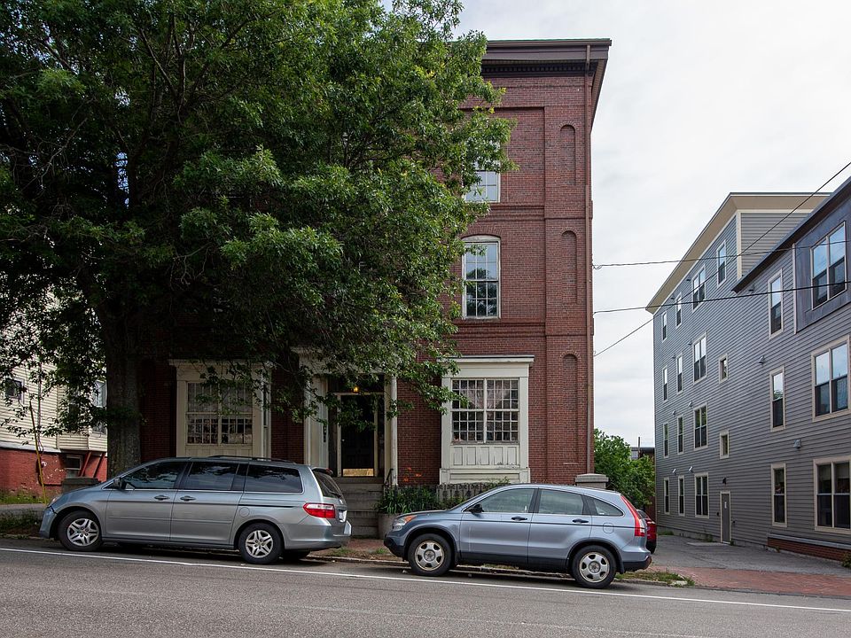 Front of the building, first apartment on the left.