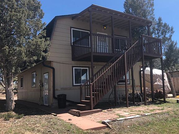 Carriage House on top floor with Storage area on ground level.