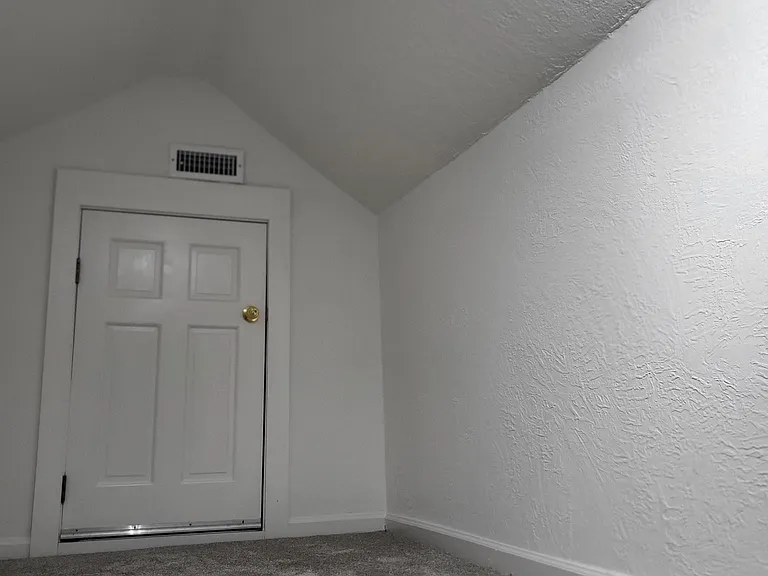 One view of the upstairs loft - can use this area plus another section of the loft for storage, office space, or get a big bean bag chair and lounge (thats the attic door).