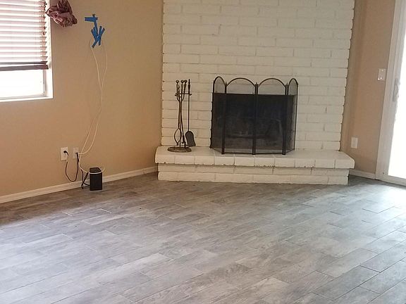Family room with tile floor, fireplace
