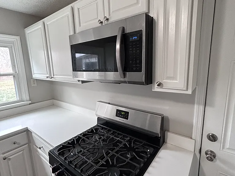 Plenty of cabinet space and sunlight in this immaculate fully updated kitchen with gas stove