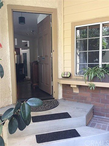 Side Entry is covered and to the right is the door to the 2 car garage.