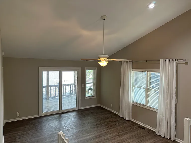 Second floor, living area looking out to deck and lake