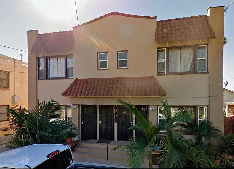 Front of building with beautiful landscaping