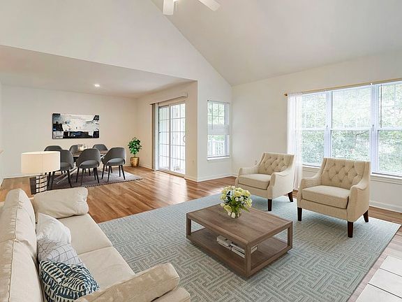 Renovated Package I living and dining area with hard surface flooring