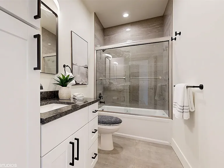Adjacent to Bedroom 3, the luxurious bathroom features high-end finishes and abundant cabinet space, offering both style and functionality.